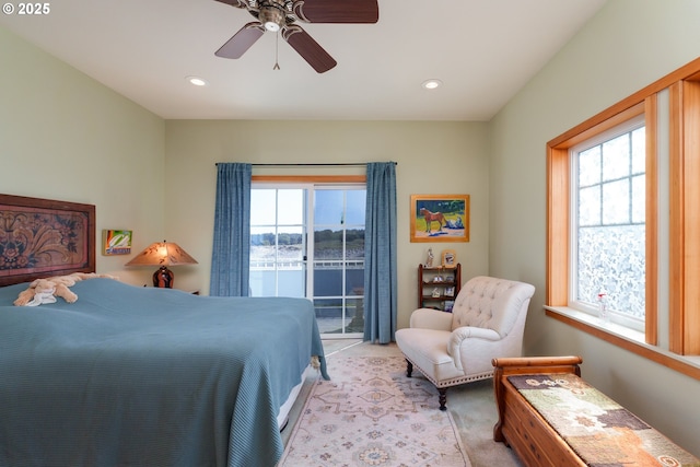 1327 Village Loop, Bandon, OR 97411 - bedroom with recessed lighting, access to exterior, multiple windows, and light carpet