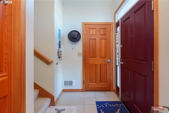1327 Village Loop, Bandon, OR 97411 - entryway featuring light tile patterned flooring, baseboards, visible vents, and stairs