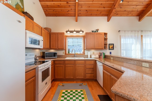 1327 Village Loop, Bandon, OR 97411 - kitchen featuring light wood-type flooring, a sink, white appliances, beamed ceiling, and wooden ceiling