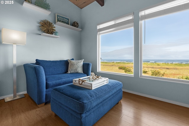2316 Beach Dr Unit 157, Seaside, OR 97138 - sitting room with wood finished floors, baseboards, and lofted ceiling