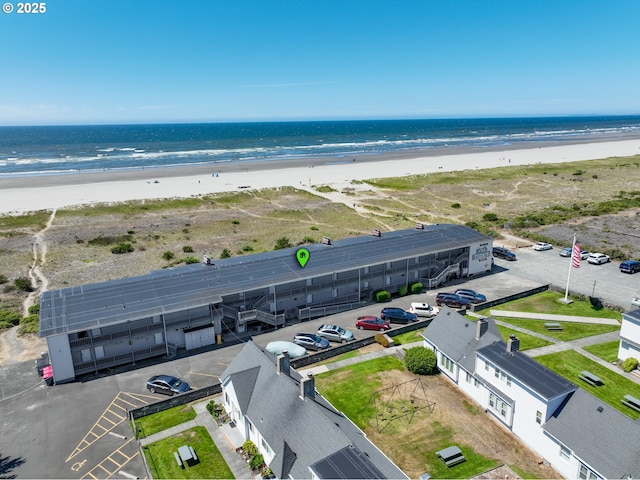 bird's eye view with a view of the beach and a water view