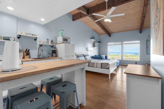 2316 Beach Dr Unit 157, Seaside, OR 97138 - kitchen featuring white appliances, a sink, wood finished floors, wooden ceiling, and a ceiling fan