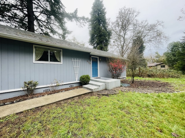 view of front of house with a front yard and crawl space