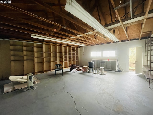 interior space featuring concrete flooring and a garage