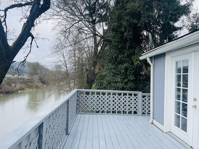 wooden deck featuring a water view