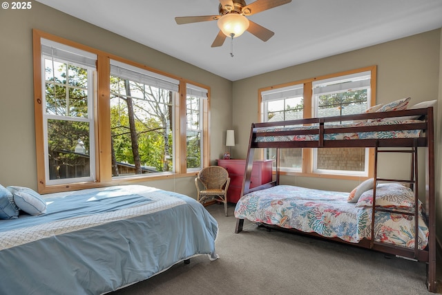 carpeted bedroom with a ceiling fan