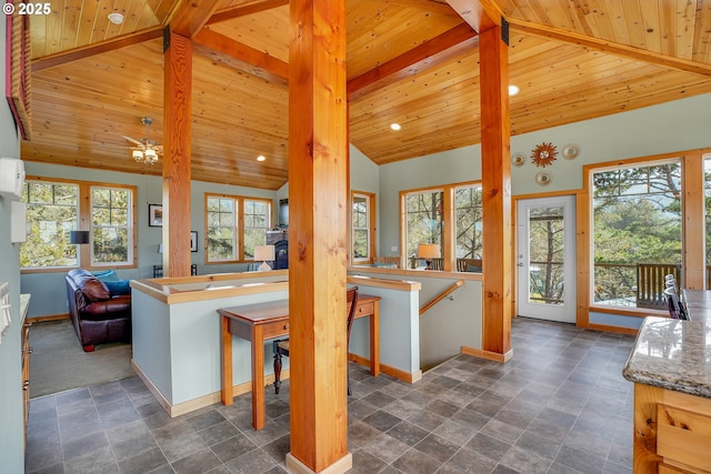kitchen with baseboards, recessed lighting, wood ceiling, and vaulted ceiling with beams