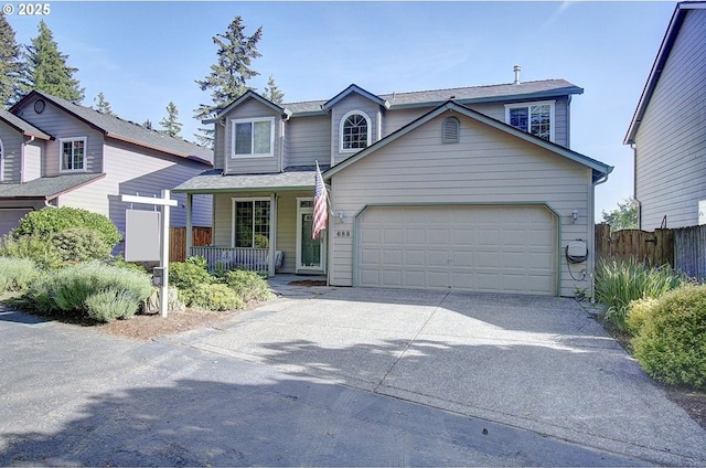 688 53rd St, Washougal, WA 98671 - traditional-style home with concrete driveway, an attached garage, and a porch