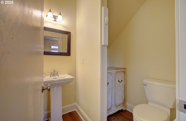 688 53rd St, Washougal, WA 98671 - bathroom with wood finished floors, toilet, and baseboards