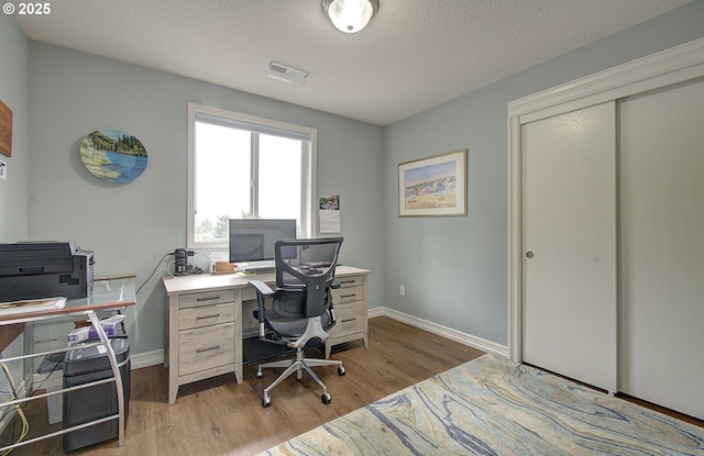688 53rd St, Washougal, WA 98671 - home office featuring wood finished floors, baseboards, and a textured ceiling