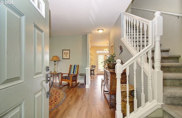 688 53rd St, Washougal, WA 98671 - entrance foyer featuring light wood finished floors, stairs, and a chandelier