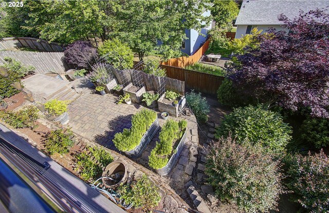 688 53rd St, Washougal, WA 98671 - fenced backyard with a patio area and a vegetable garden