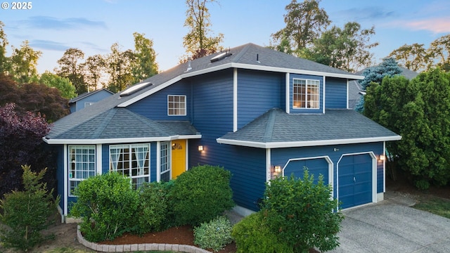 15421 SW Thurston Ln, Portland, OR 97224 - traditional home featuring roof with shingles, a garage, and concrete driveway
