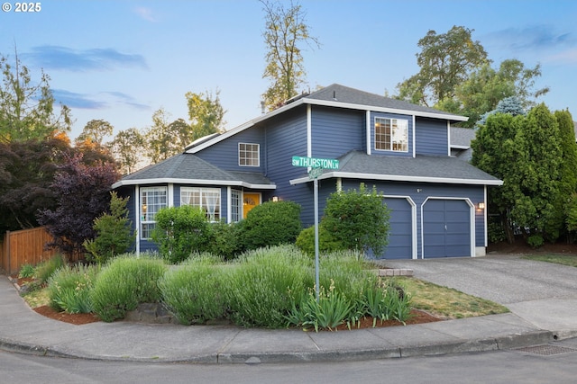 15421 SW Thurston Ln, Portland, OR 97224 - traditional-style house featuring an attached garage, driveway, and roof with shingles