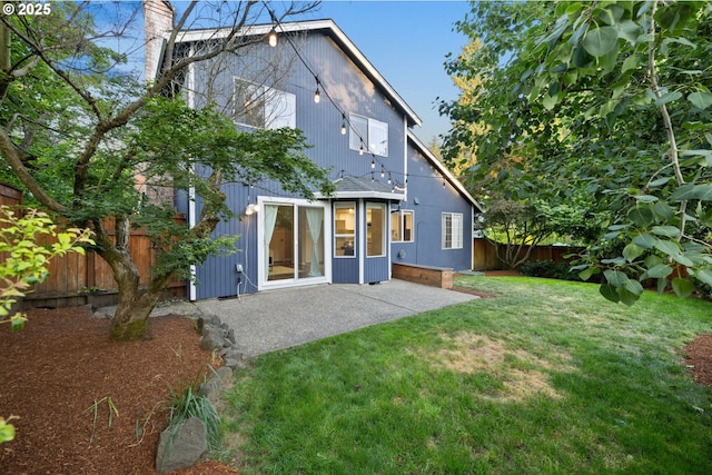 15421 SW Thurston Ln, Portland, OR 97224 - rear view of house featuring a patio and a chimney