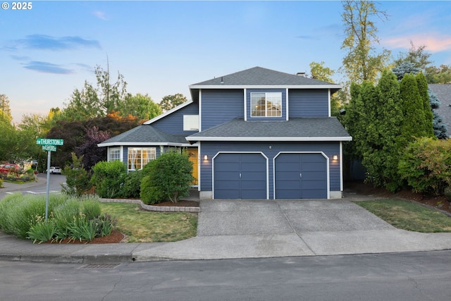 15421 SW Thurston Ln, Portland, OR 97224 - traditional-style house featuring an attached garage, concrete driveway, and roof with shingles