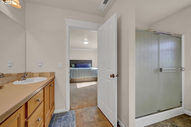 full bath with visible vents, ensuite bathroom, a stall shower, vanity, and tile patterned flooring