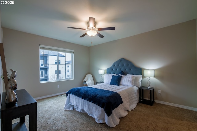 bedroom with ceiling fan and carpet flooring