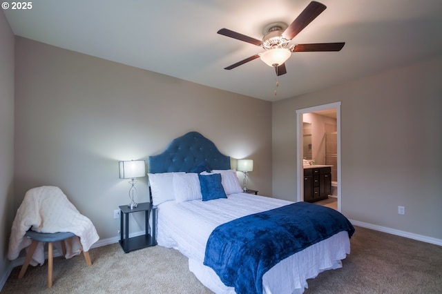 carpeted bedroom with ceiling fan and ensuite bathroom