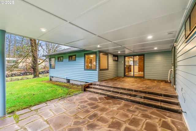 exterior space with a yard and an attached carport