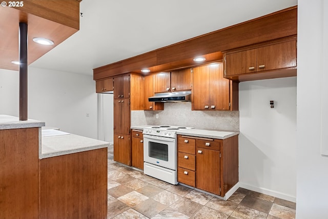 kitchen with backsplash, brown cabinetry, white electric stove, and under cabinet range hood