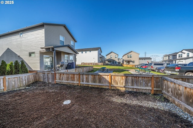 view of yard with a residential view and fence