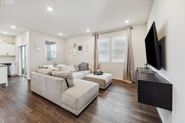 living room with baseboards, dark wood finished floors, and recessed lighting