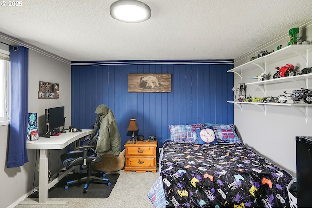 bedroom with a textured ceiling and carpet