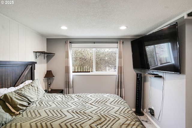 bedroom featuring carpet flooring, a textured ceiling, and crown molding