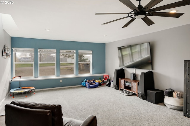 living area featuring recessed lighting, carpet, baseboards, and ceiling fan