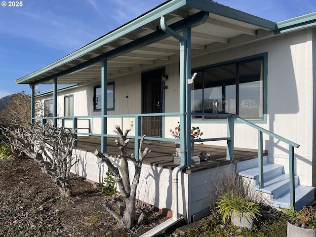 view of property exterior with a sunroom