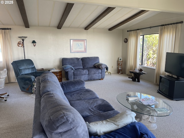 carpeted living room featuring vaulted ceiling with beams