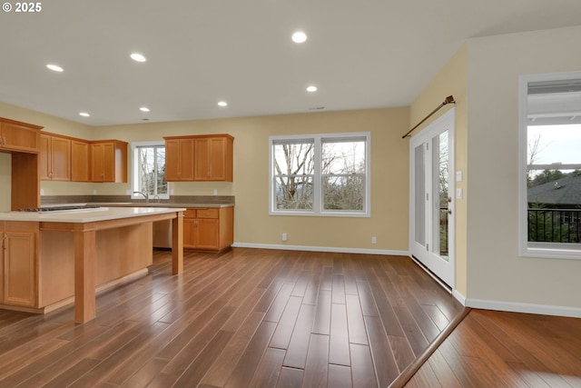 6018 Fernhill Loop, Springfield, OR 97478 - kitchen with dark wood finished floors, light countertops, baseboards, and recessed lighting
