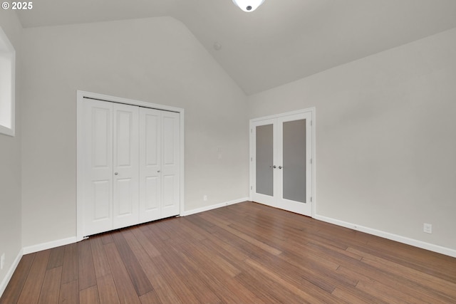 6018 Fernhill Loop, Springfield, OR 97478 - unfurnished bedroom featuring french doors, wood finished floors, high vaulted ceiling, a closet, and baseboards