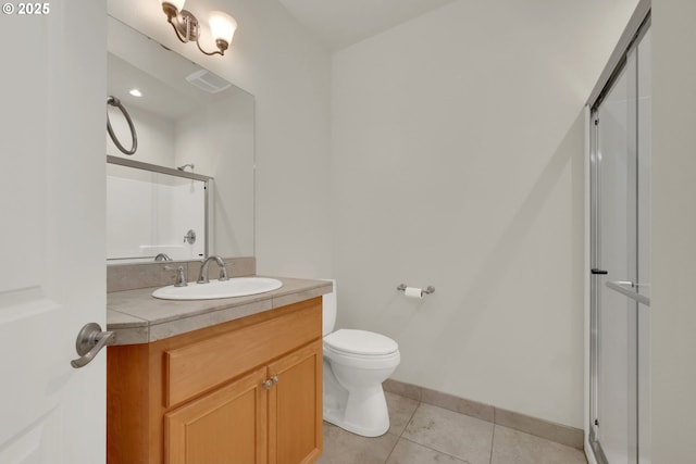 6018 Fernhill Loop, Springfield, OR 97478 - bathroom with an enclosed shower, tile patterned flooring, toilet, vanity, and baseboards