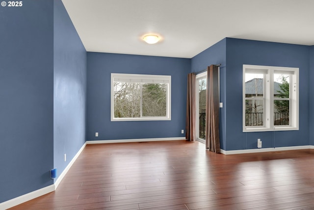 6018 Fernhill Loop, Springfield, OR 97478 - spare room with baseboards and wood finished floors