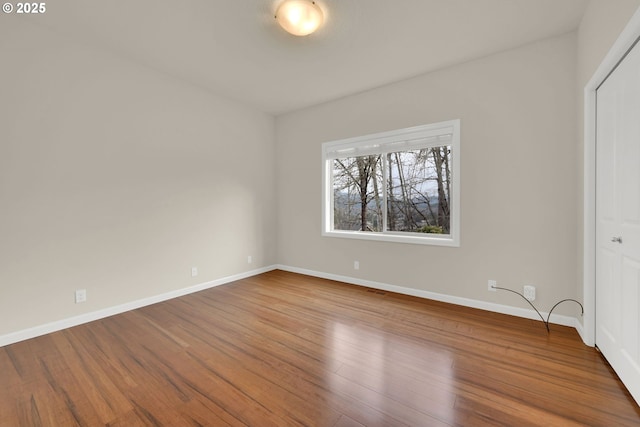 6018 Fernhill Loop, Springfield, OR 97478 - unfurnished bedroom with baseboards and wood finished floors