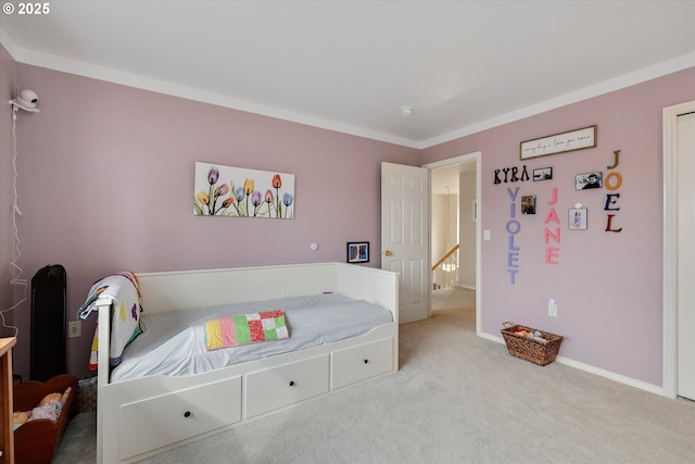 carpeted bedroom featuring baseboards