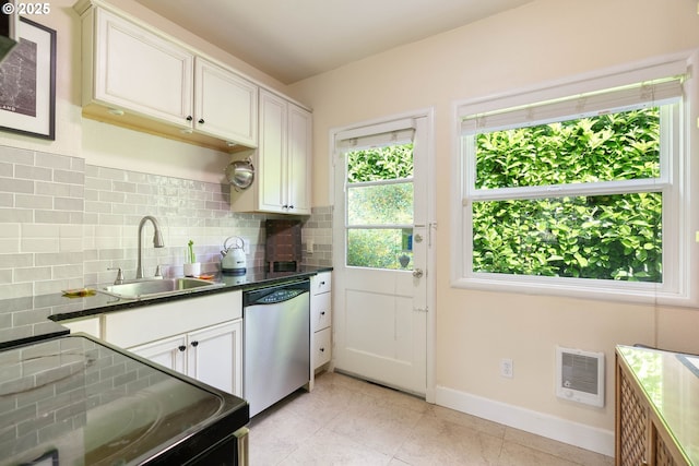 kitchen with dishwasher, a sink, black / electric stove, baseboards, and backsplash