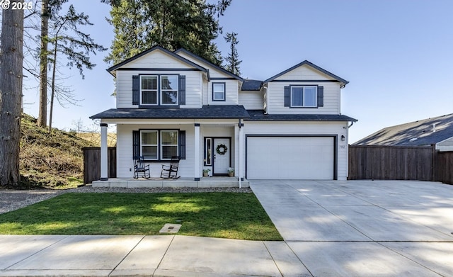 front facade featuring a porch, a garage, and a front lawn