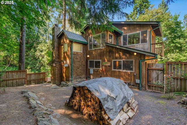 3820 Kenthorpe Way W, Linn, OR 97068 - back of property featuring a chimney and a gate