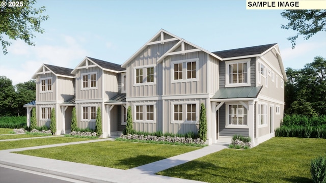 multi unit property with a front yard, a standing seam roof, and board and batten siding