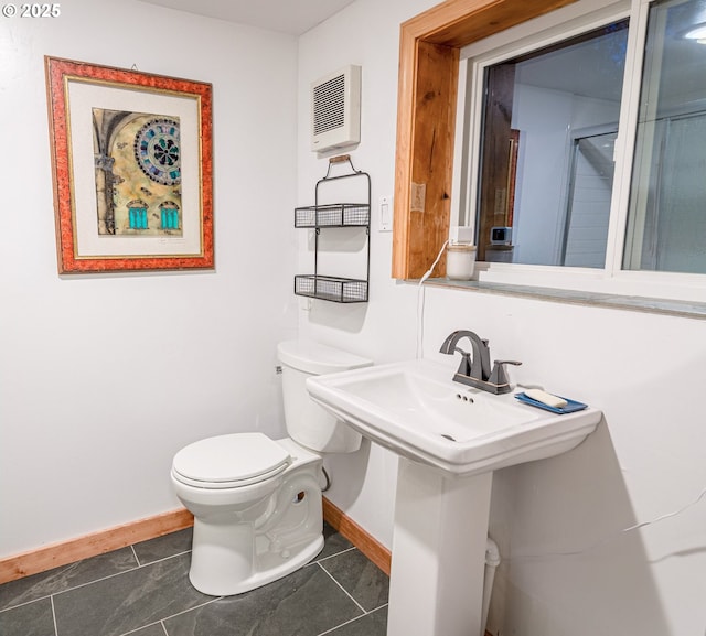37459 Boulder Flat Ln, Halfway, OR 97834 - bathroom with baseboards, toilet, tile patterned floors, and heating unit