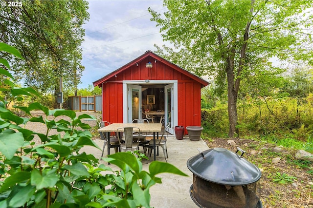 37459 Boulder Flat Ln, Halfway, OR 97834 - view of shed with outdoor dining area and a fire pit