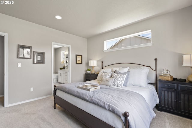 bedroom featuring recessed lighting, baseboards, connected bathroom, and light colored carpet