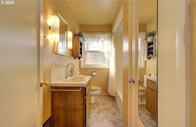 full bathroom featuring vanity, shower / bath combo, and toilet