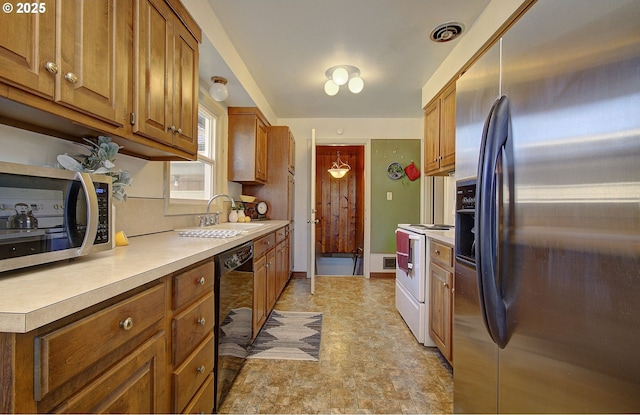 kitchen featuring appliances with stainless steel finishes and sink