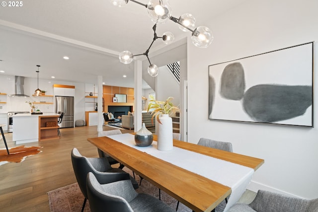 dining room with light wood-style floors and recessed lighting
