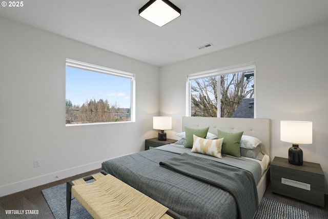bedroom featuring baseboards, carpet, and visible vents