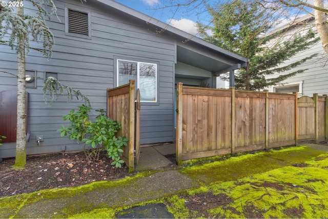 view of property exterior featuring fence